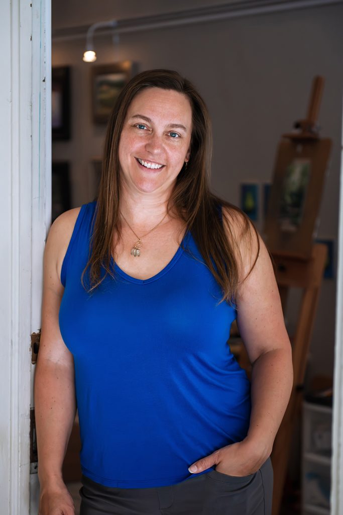 The artist in her studio doorway.